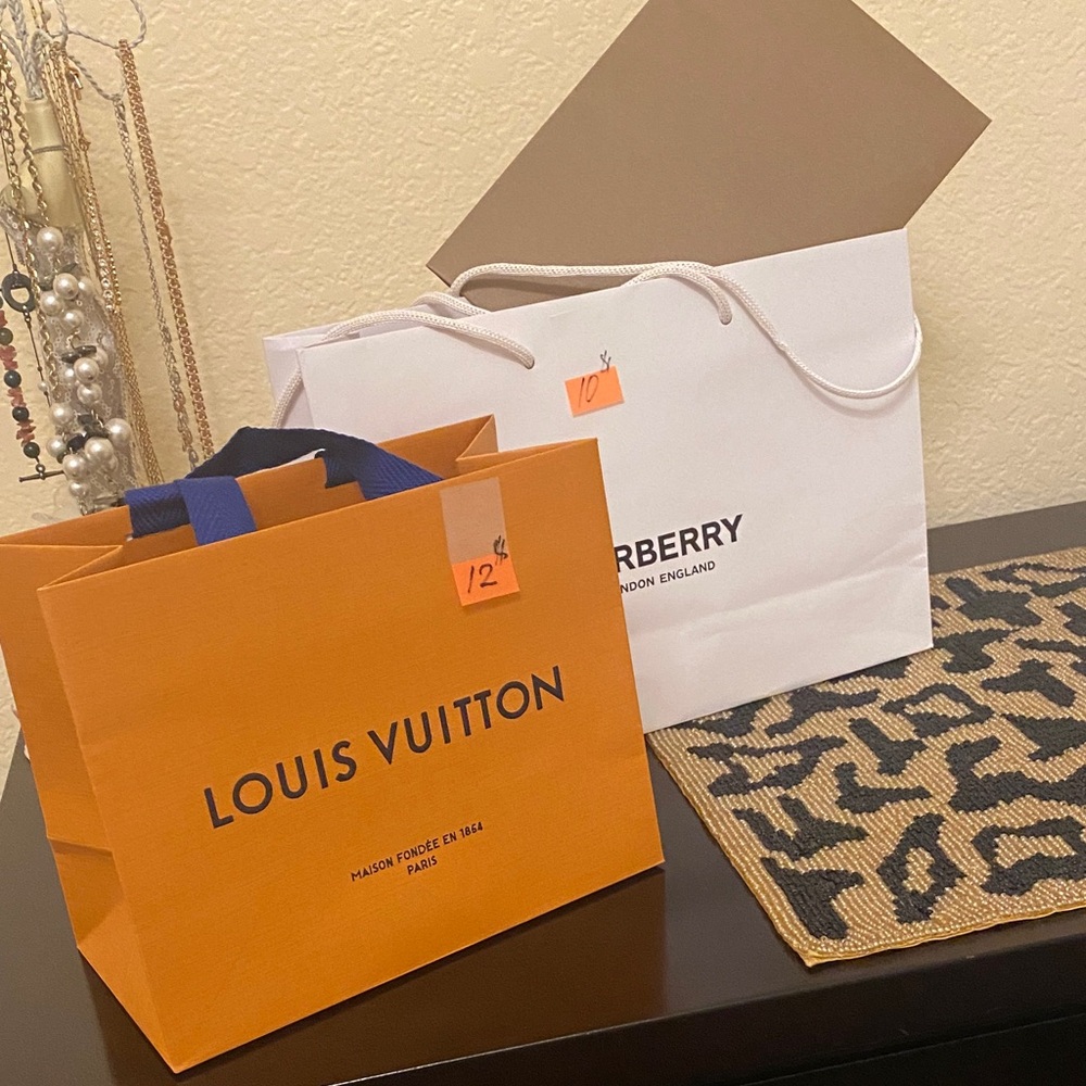 Burberry bag and envelope, Louis Vuitton bag.